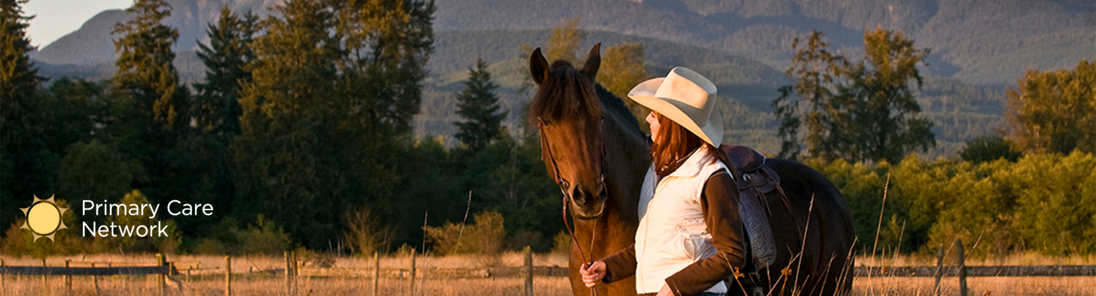 Rancher with horse in field 